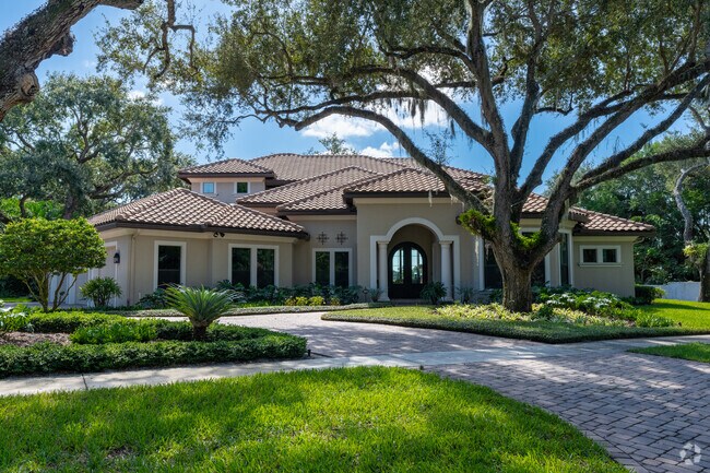 An exemplary Spanish Revival home gracing the St. Lucie River's edge.