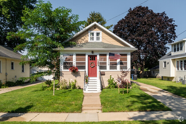 Traditional style home with a red entrance door is located in Congress Field.