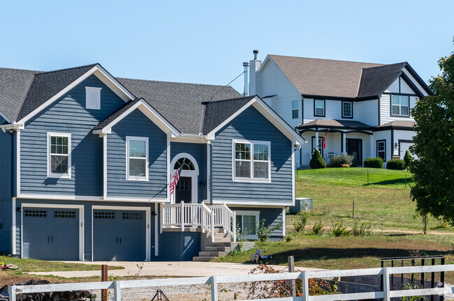 Hillside homes with vast views of fields sit atop the Rainbow neighborhood.