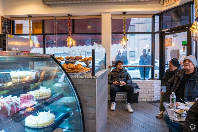 Customers can sit and watch soccer matches together in the City Cafe & Grill in Journal Square.