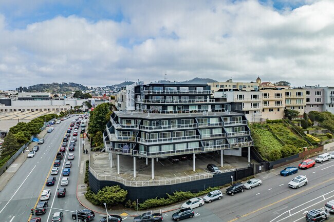 A raised apartment building sits above the streets of San Francisco in Jordan Park/Laurel Heights.