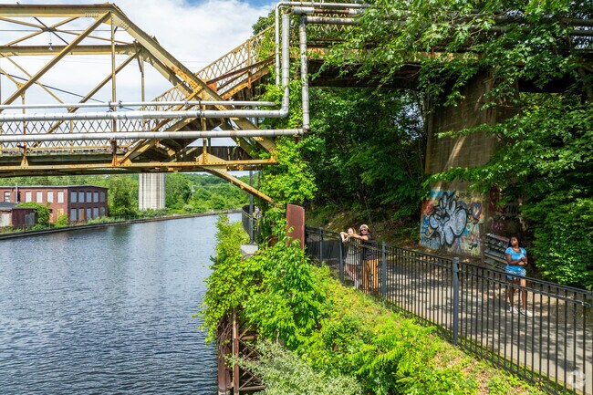People gaze at the old factories and mills that once made Turners Falls a paper mill town.