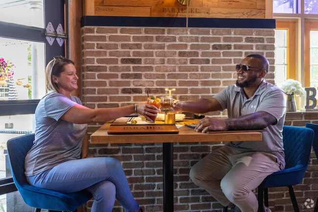 Enjoy a delicious meal with your special someone at Parallel Wine & Whiskey Bar in Broadlands.