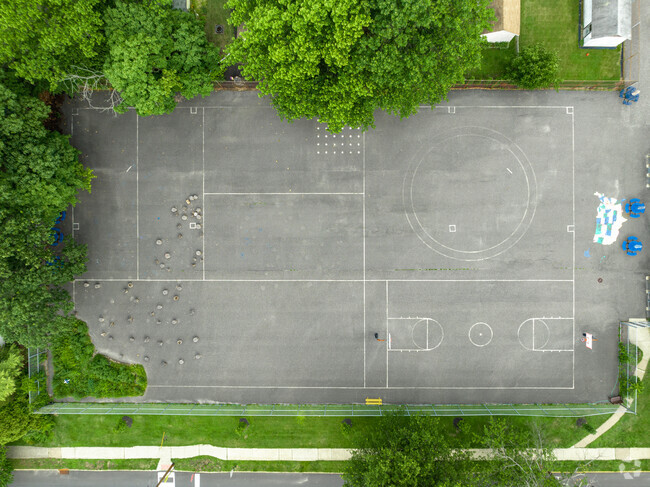 Large fenced in activity court at Mark Newbie Elementary School in Collingswood, NJ.