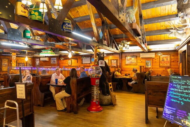 Families enjoy dinner inside Buddy’s Log Cabin Family Restaurant near Washington Township.