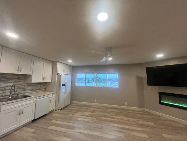 spacious living, dining kitchen with view of mission valley