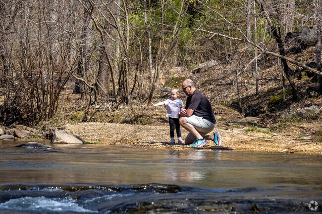 Having a touching moment by the water’s edge in Turkey Creek Nature Preserve.