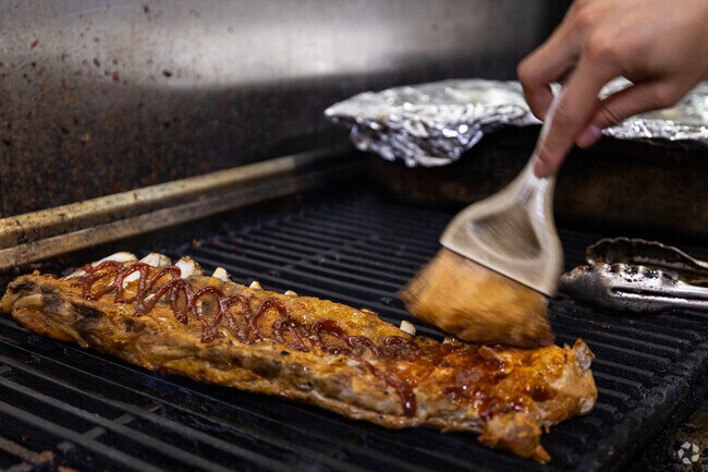 Fat Pig BBQ near Talbot Park is known for tender ribs and smoked meats.