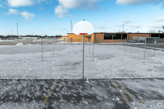 Curtis Middle School has an outdoor basketball court.
