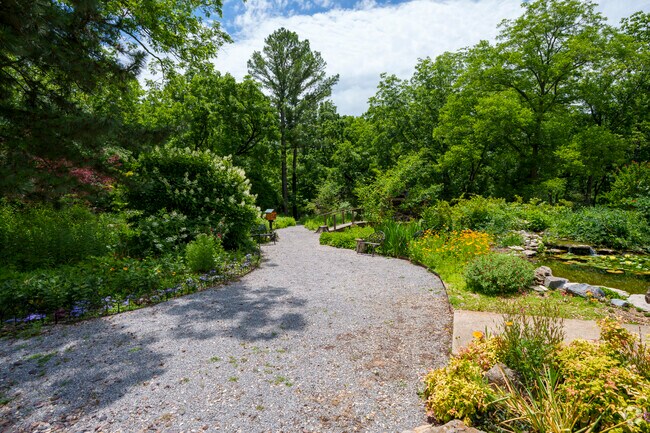A gravel path winds through the native greenery at Webster's Garden in Pryor Creek.