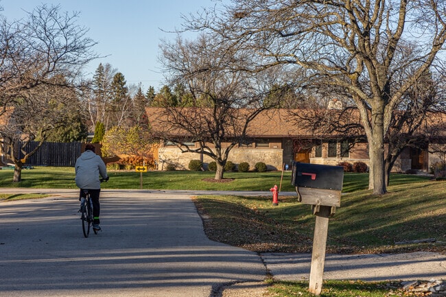Bayside’s quiet streets are ideal for biking under mature trees.