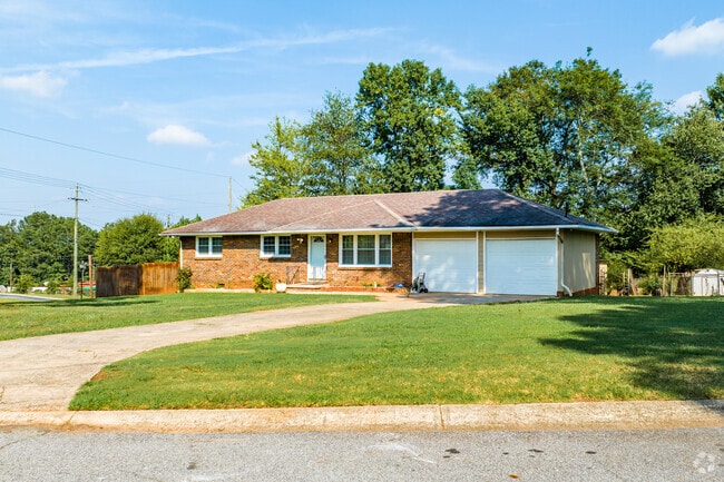 Brick ranch homes in in College Park sit on lots with simple landscaping.