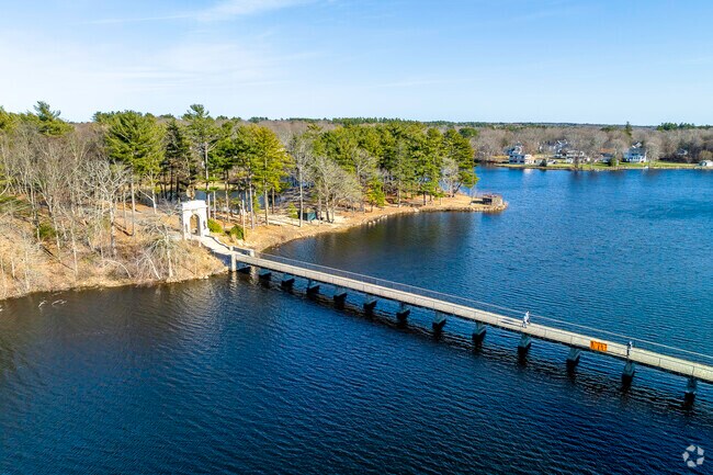 Beautiful view of Island Grove Park has a nice bridge to get across the water.