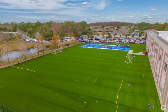 Henderson Hammock Charter School features a play area behind the school.