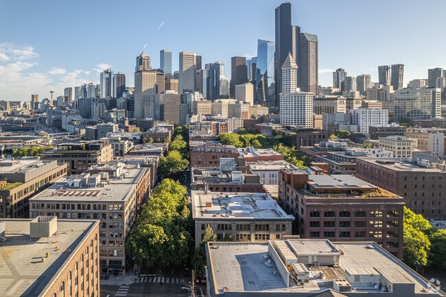 An aerial view of the Pioneer Square neighborhood with Downtown Seattle in the background.