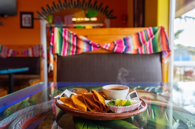 Warm your belly with a delicious plate of quesobirria from Monarca Restaurant.