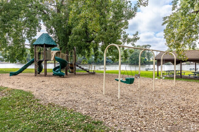 The playground at Bathing Beach Park offers panoramic views of the river.