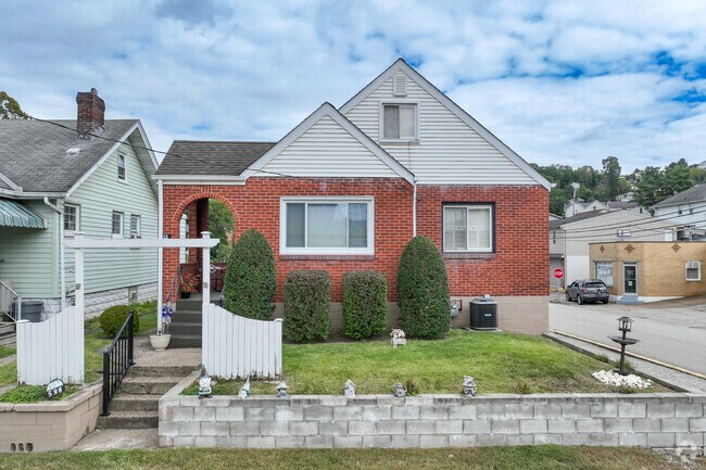 A cozy one-story brick house in Pitcairn, perfect for a new family.