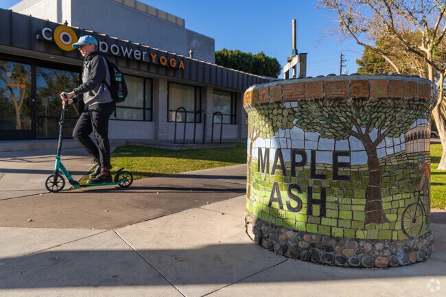 There are mosaic art and signage in the artsy neighborhood of Maple Ash.
