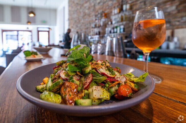 Enjoy fine food and drinks at Zaytoon restaurant.