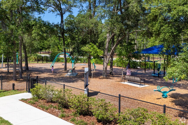 Mom and the kids are enjoying the playground.