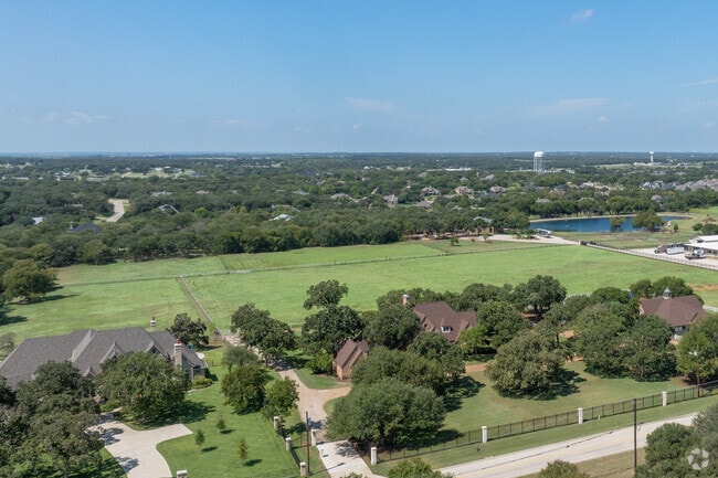 Quiet Double Oak roads lead to landscaped homes on one-acre-plus lots with attached garages.