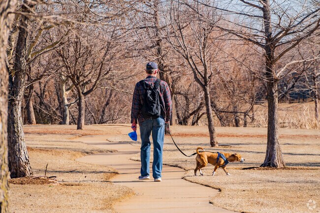 Locals enjoy walking their dogs on the winding nature trails of Valencia Park.
