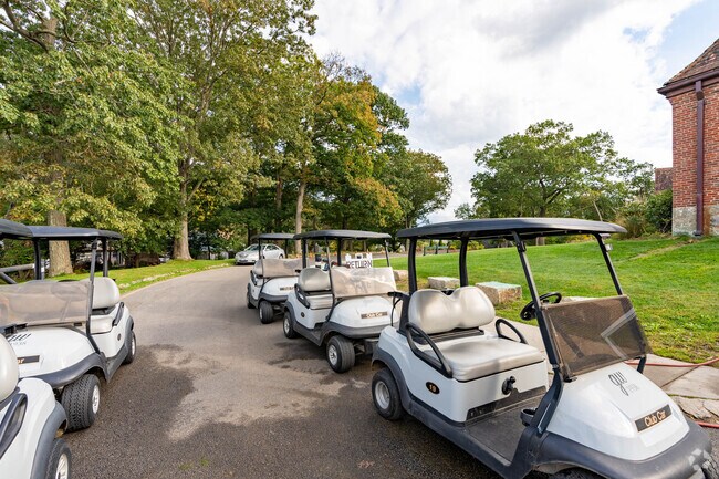 Golf caddies line paths at George Wright Golf Course in Hyde Park.
