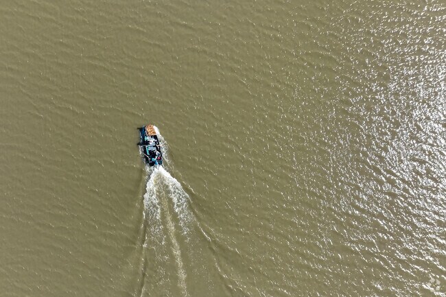 People moving to their next fishing spot on the lake at George C Winter Park.