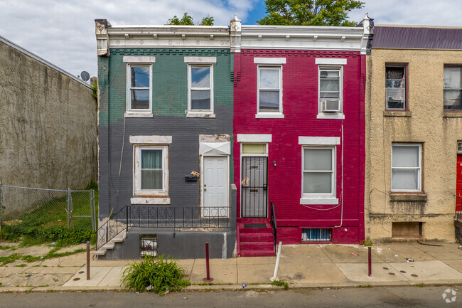 Brick Allegheny West row homes sit right up on the street.