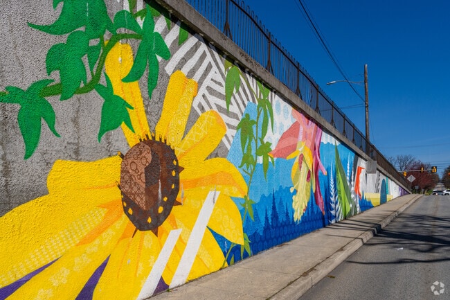 Paxtang greets visitors with vibrant floral murals celebrating nature and community pride.