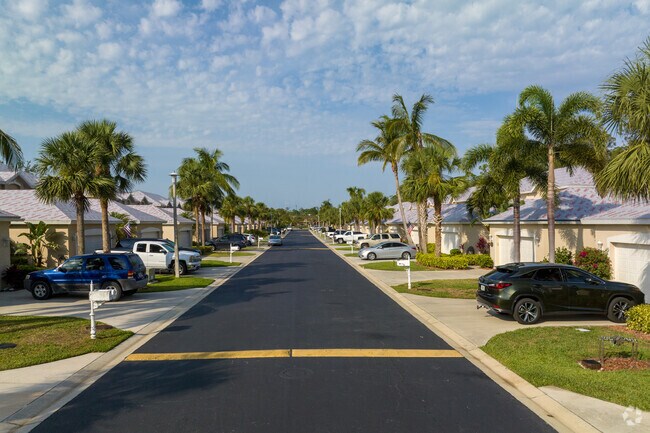 A quiet palm tree lined street in the Council neighborhood in Bonita Springs, Florida.