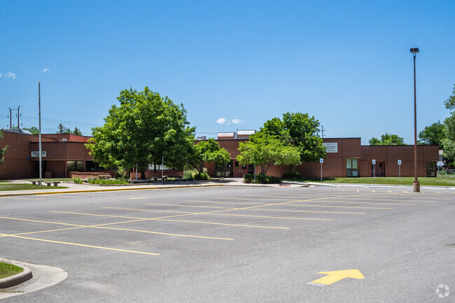Parking and the main building at Sheridan Green Elementary in Broomfield, Colorado.