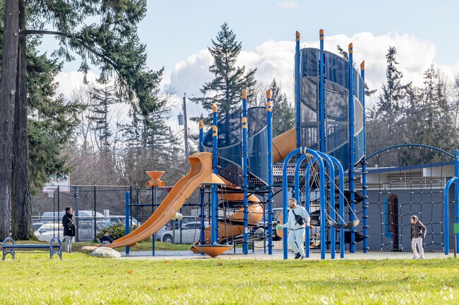 A family enjoys the break in the clouds at Dawsons Playfield in Midland WA.