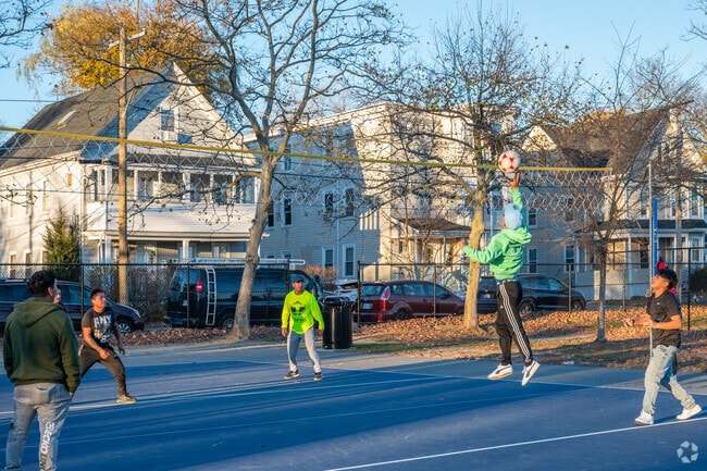 Residents of Clifton Heights gather to play vollyball at James Edgar Playground.