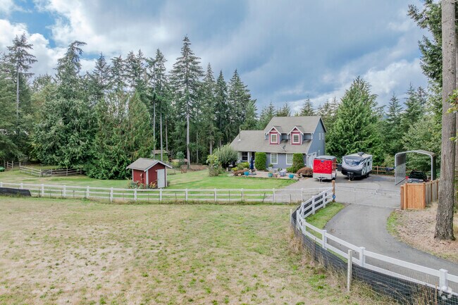 This beautiful craftsmen home sits on acreage in Burley WA.