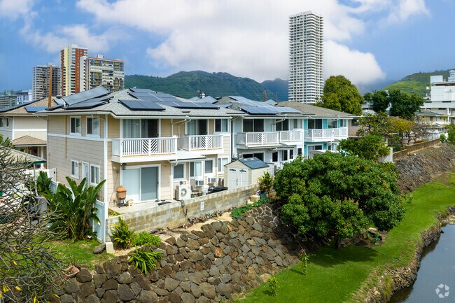 Newer homes line up along the canal in the McCully-Mō'ili'ili neighborhood in Honolulu, HI.