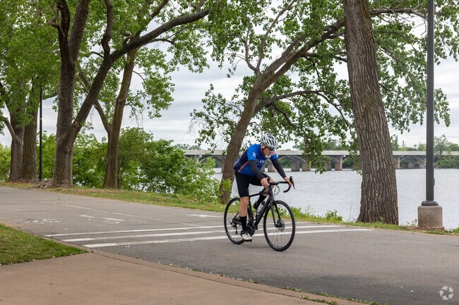 Cyclist travel along the Rivertrail that runs along the West side of Riverview.
