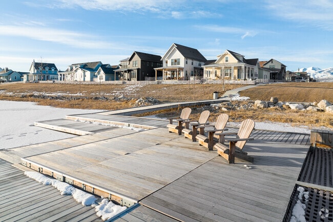 Residents can relax around Lake Oquirrh in Adirondack chairs on one of the many docks.