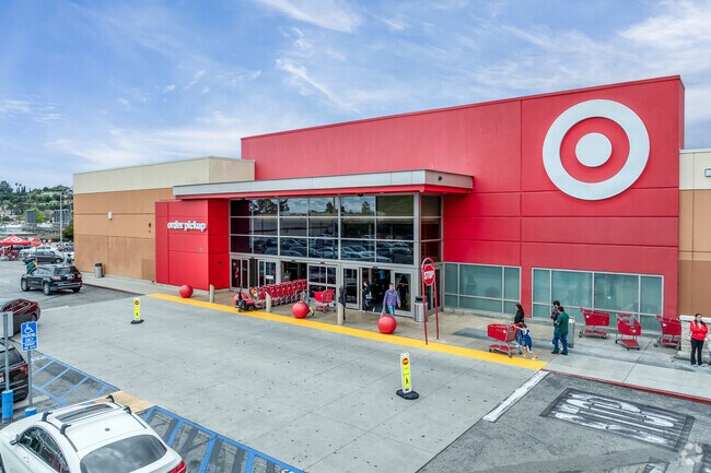 Shoppers skillfully maneuver their way through the busy parking lot, balancing bags and children while keeping an eye out for friendly faces amidst the hustle and bustle at the Target in Dolgeville.