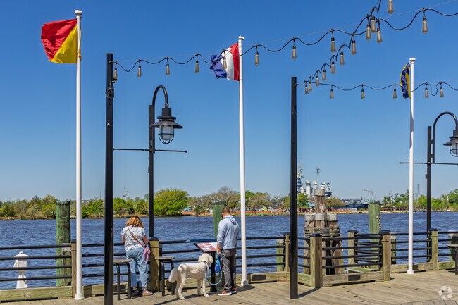 Residents of Rogersville-Bradley Creek enjoy the riverfront boardwalk in downtown Wilmington.