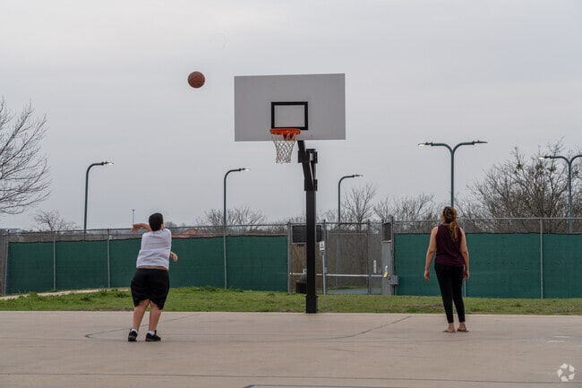 Locals can find a full-size basketball court at Harris Branch Neighborhood Park.