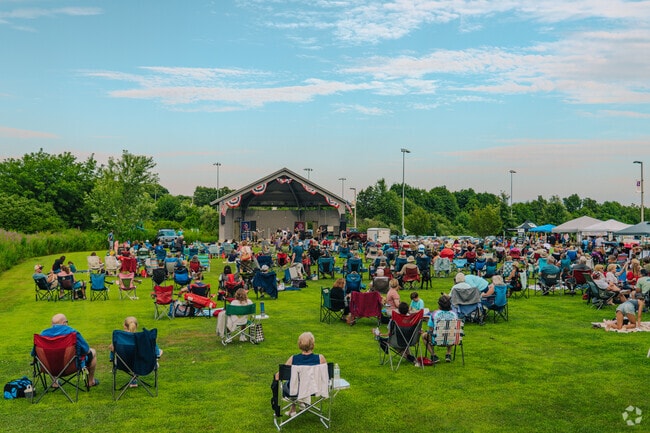 The field fills up fast as the band begins to perform their openning song at the summer concert.