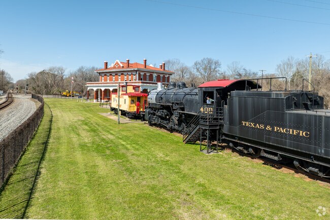 The heart of Marshall, Texas, where the iconic courthouse stands proudly at the center of town, bustling with local life and community spirit.