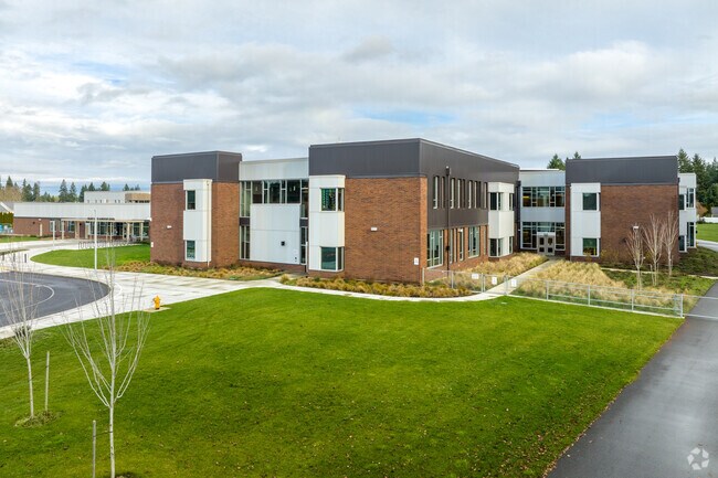 Walnut Grove Elementary Minnehaha, Vancouver, WA, is a large two-story brick and metal building.