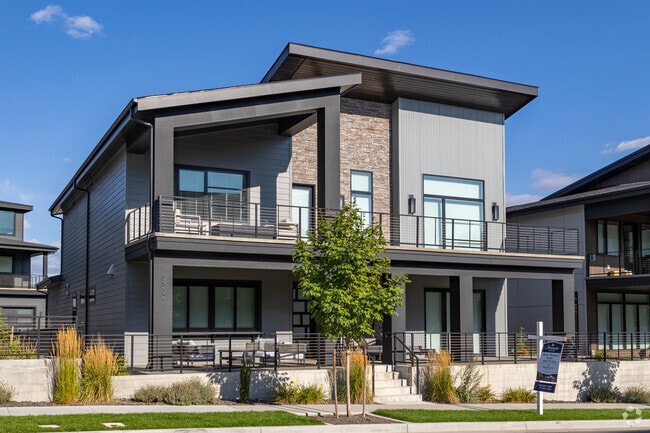 Iconic contemporary craftsman homes line the north shore of the Spokane River.