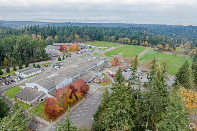 Higher aerial showing placement of school behind Middle School.