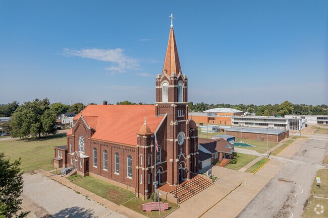 Parishioners are welcomed by the tall-steepled brick Saint Rose of Lima Church in Perry.