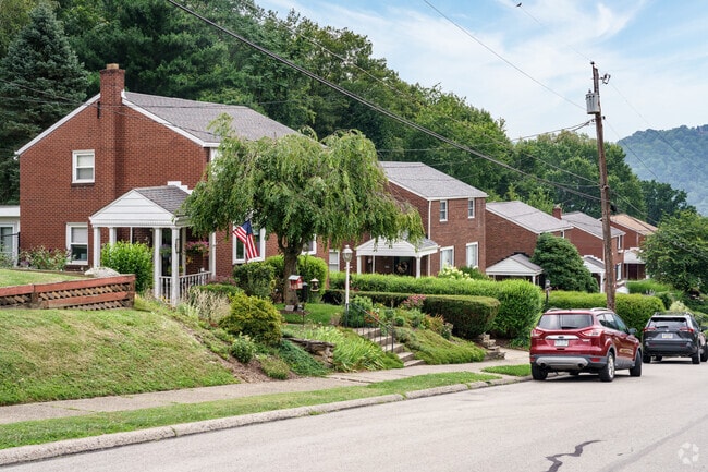These brick colonials in Springdale sit close to the street with small front yards.