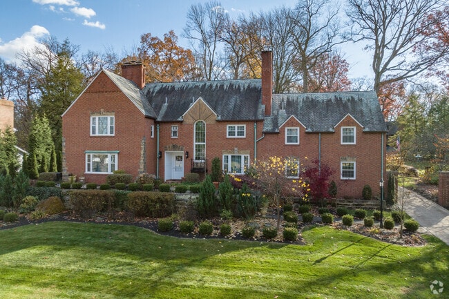 This Tudor gem sits prominently on a large lot in Avondale.